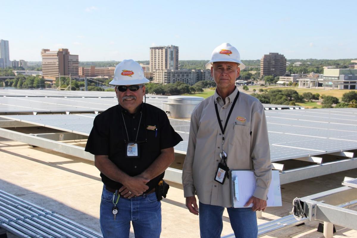 Austin Enery solar inspectors on the new Central Library roof.