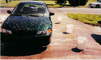 Illegal soapy discharge from a rental car facility washing operation.